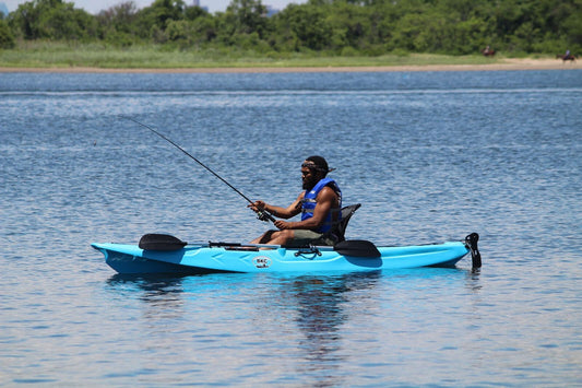 person kayak fishing