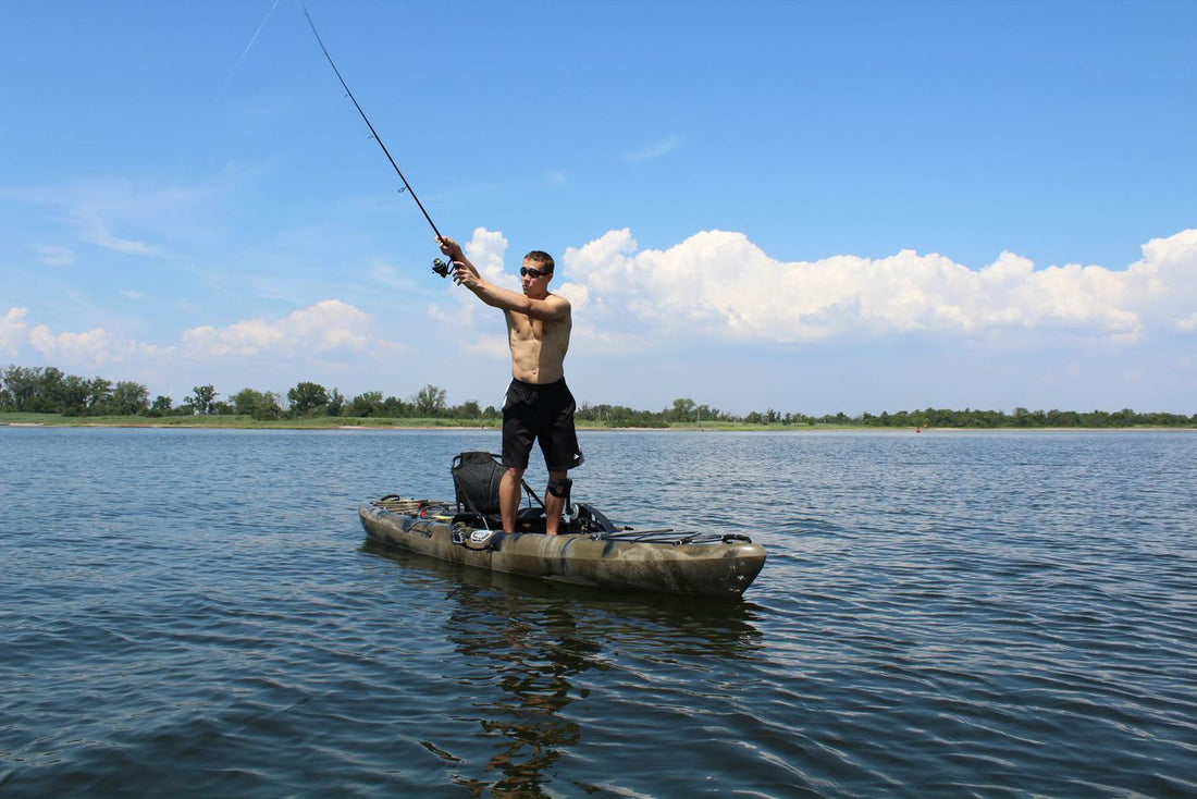 man fishing from a pedal kayak