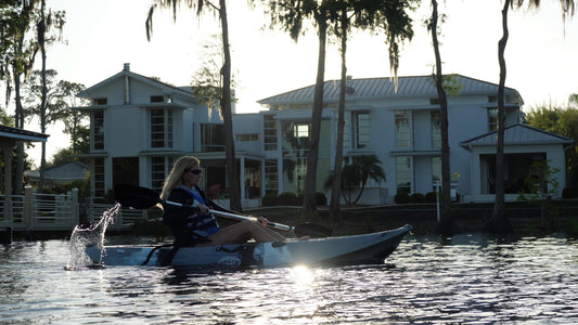 woman on a sit-on-top kayak