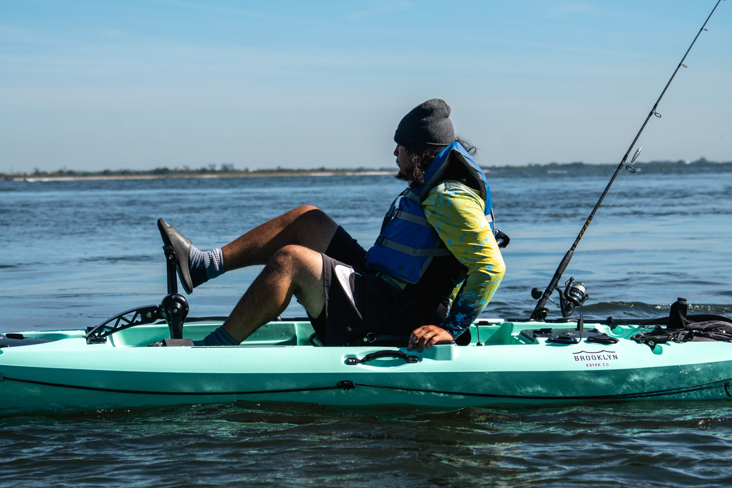 angler on a single pedal fishing kayak - Brooklyn Kayak Company