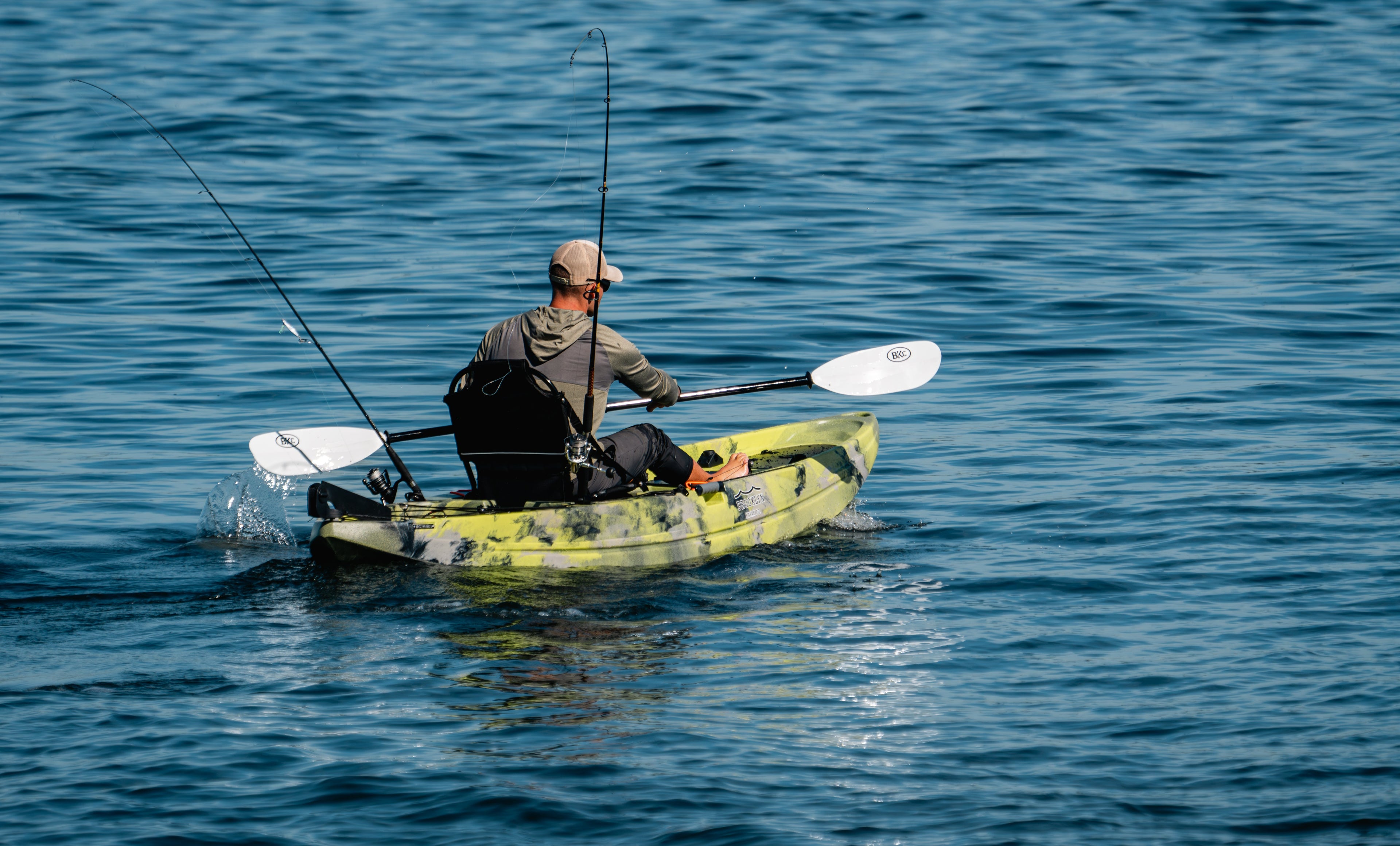 man paddling a fishing kayak - Brooklyn Kayak Company