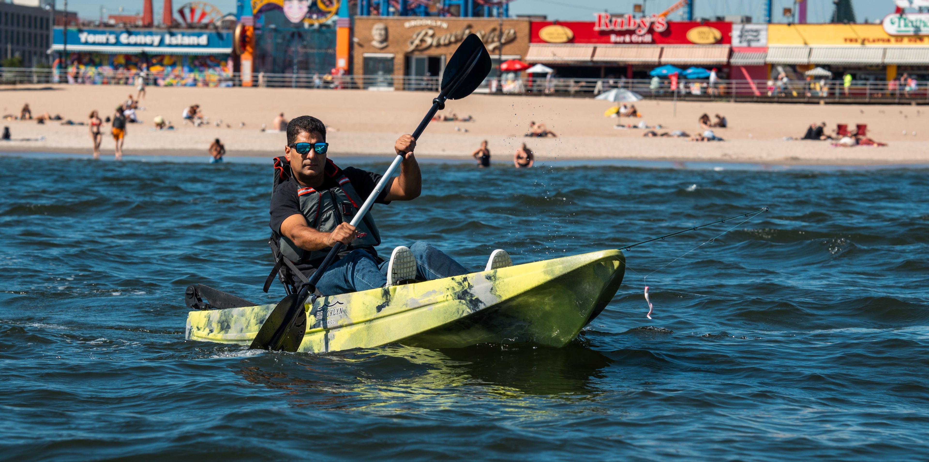 man paddling a single kayak - Brooklyn Kayak Company