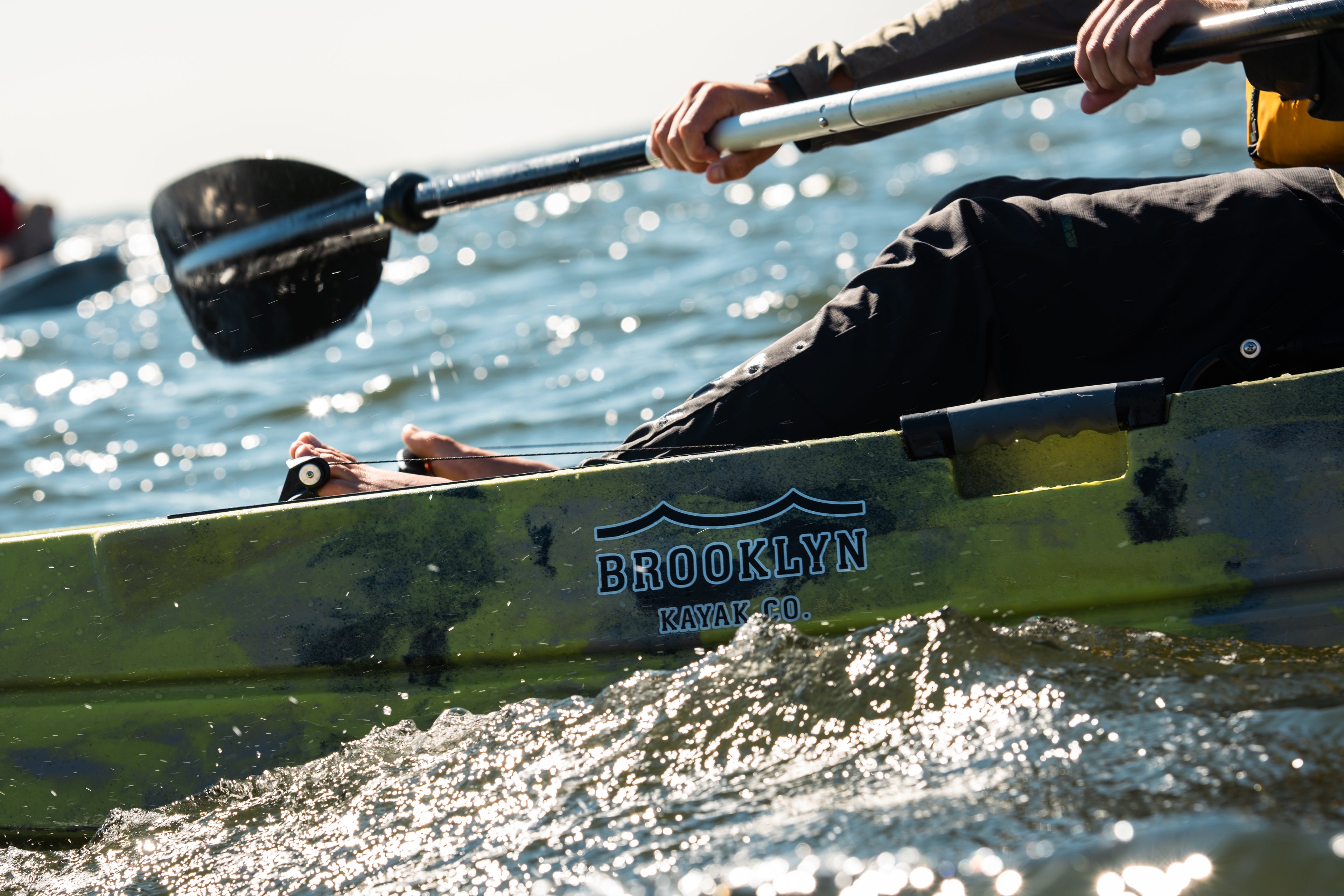 close-up image of paddling a kayak - Brooklyn Kayak Company