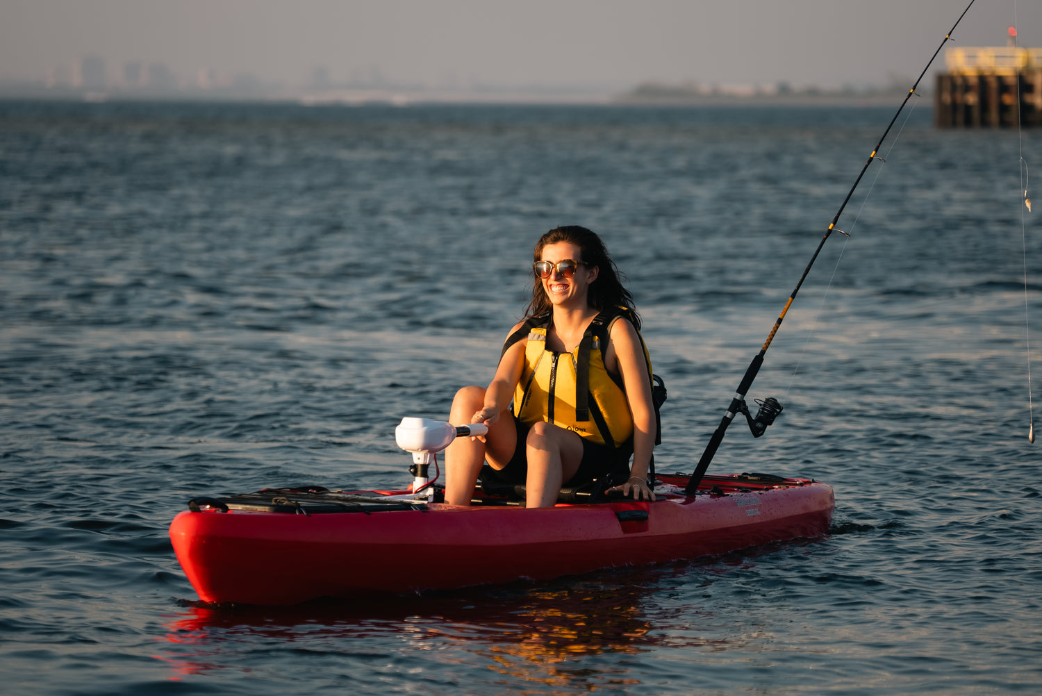 woman fishing on a motorized kayak - Brooklyn Kayak Company