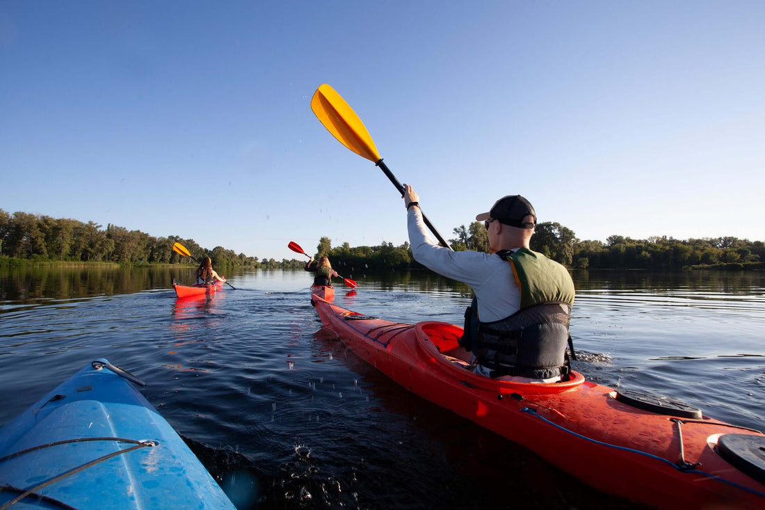 Man paddling kayak in spring - Brooklyn Kayak Company