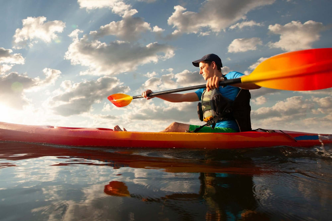 kayaker paddling to tow another kayaker - Brooklyn Kayak Company