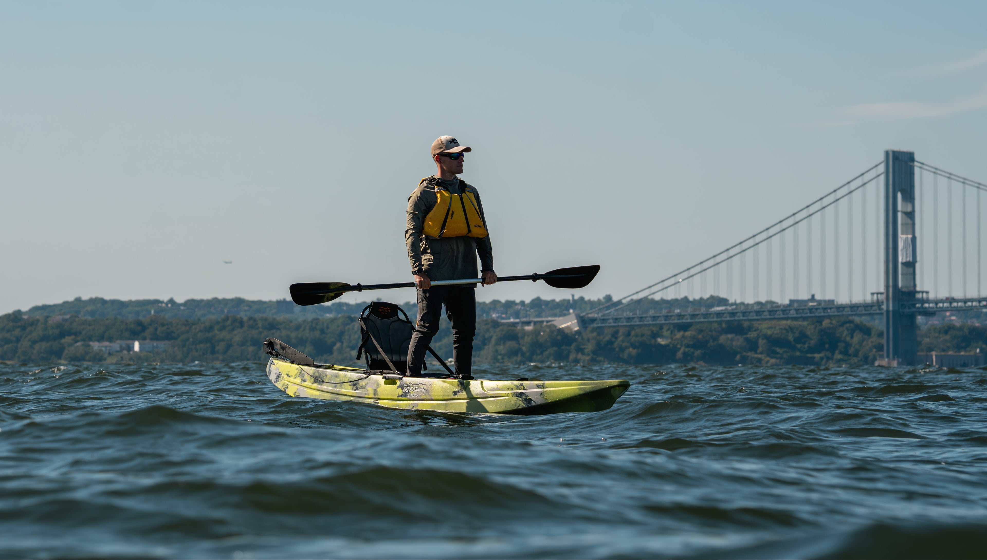 BKC fishing kayak with standing angler - Brooklyn Kayak Company