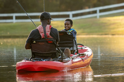 BKC Aluminum Upright seat lifestyle with father and son in tandem kayak