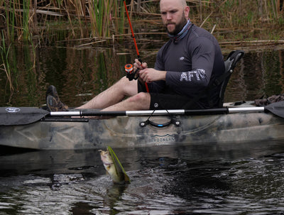 angler catching fish on Brooklyn 11.5 Pro Single Kayak - Brooklyn Kayak Company
