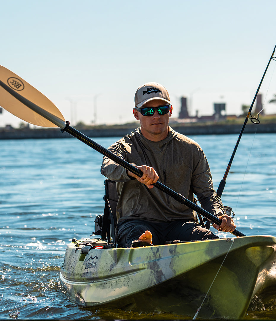 paddling a single fishing kayak closeup - Brooklyn Kayak Company