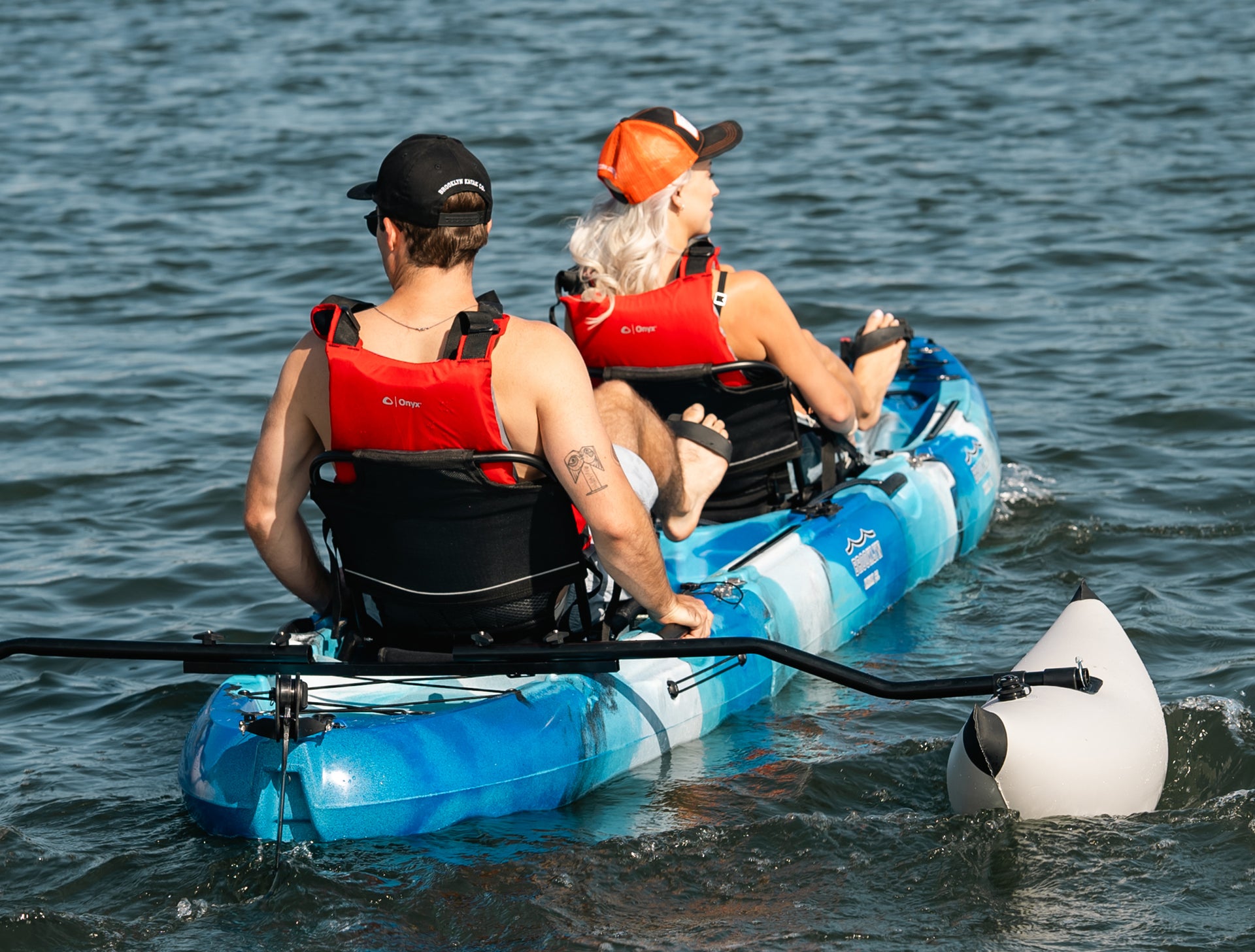 couple on a MPT13 Tandem 3-piece Modular Pedal Kayak with outriggers - Brooklyn Kayak Company