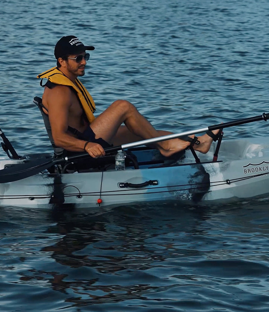 angler on single flipper pedal fishing kayak closeup - Brooklyn Kayak Company