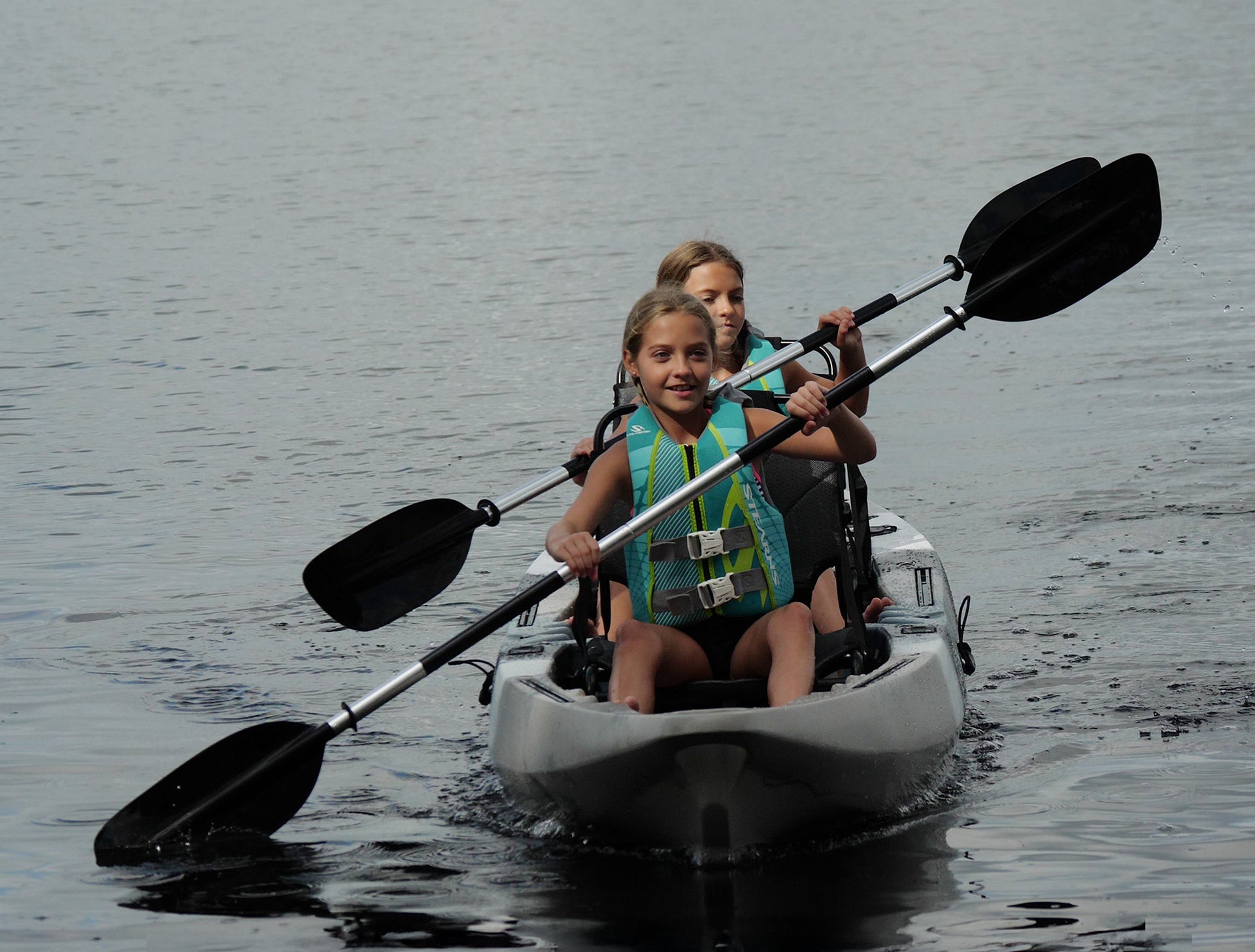 girls paddling tandem kayak - Brooklyn Kayak Company